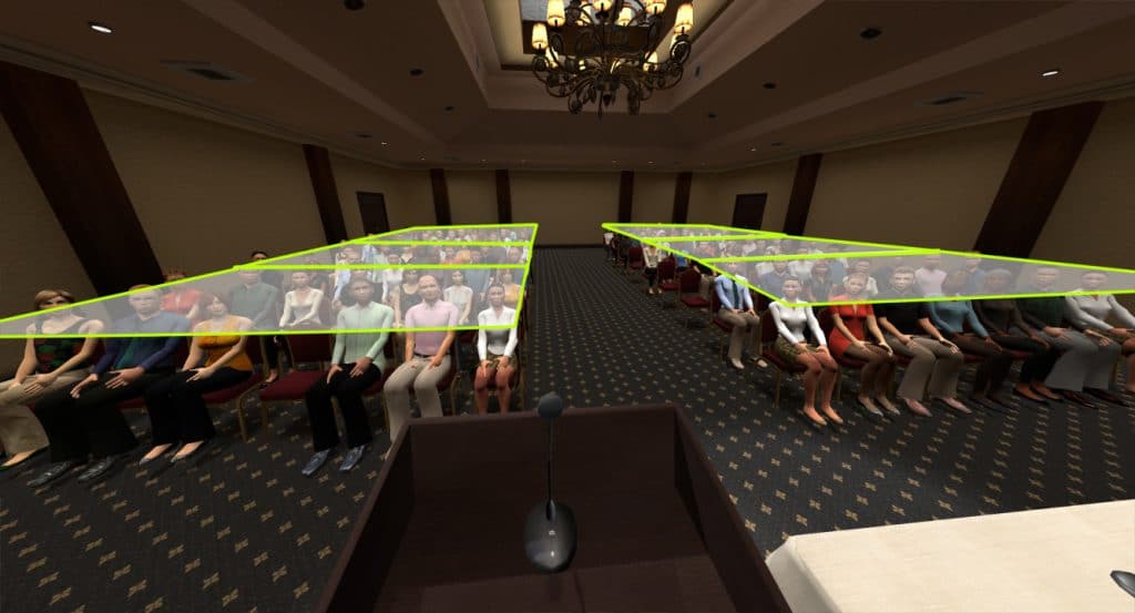 A larger hotel meeting room set up with chairs is seen. The chairs form two sections. Zones are highlighted splitting each section into 3 zones.